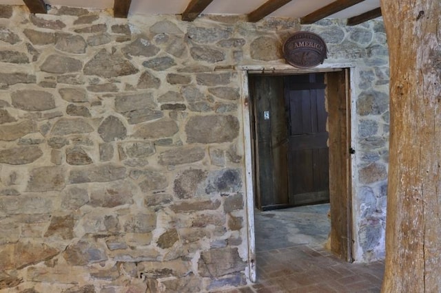 hallway with beam ceiling