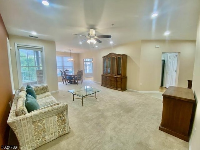 living room with light carpet and ceiling fan