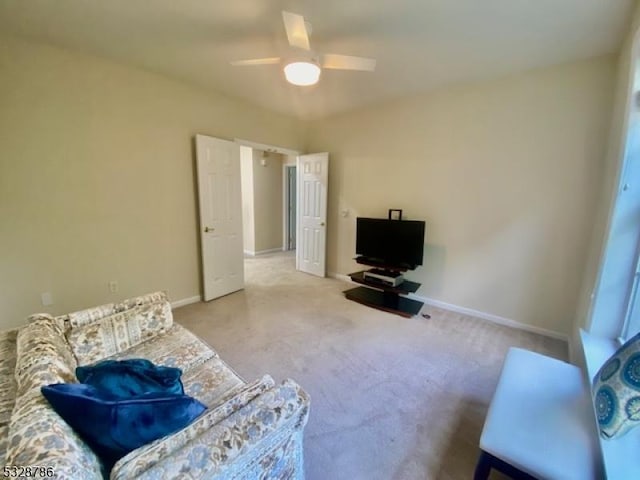 living area featuring ceiling fan and light carpet