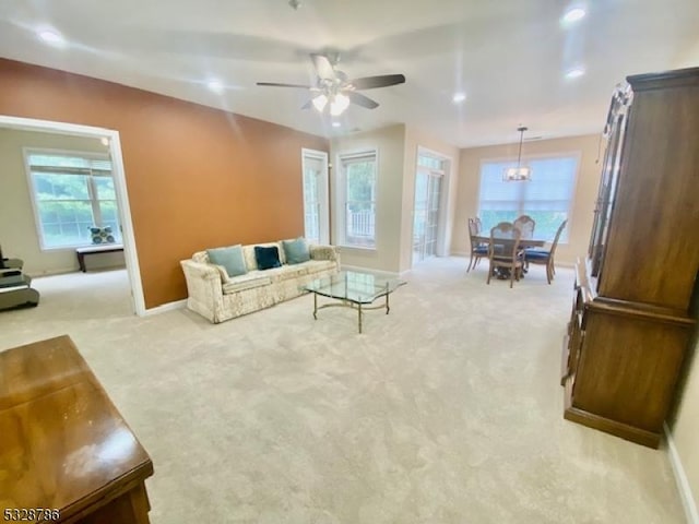 living room with light carpet and ceiling fan