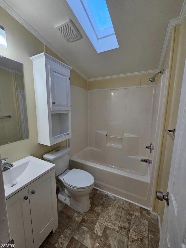 full bathroom with ornamental molding, bathtub / shower combination, vanity, lofted ceiling with skylight, and toilet