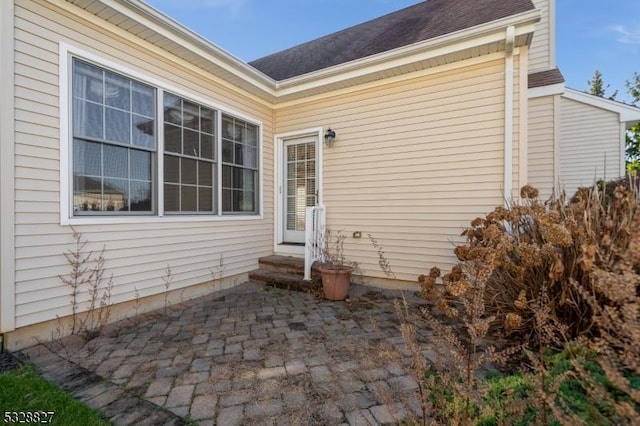 property entrance with a patio area