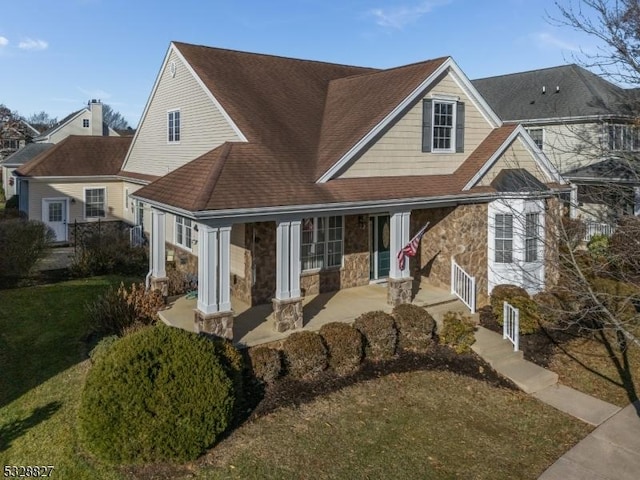 46 Falcon Way, Washington Twp, NJ 07882 - view of front of home with covered porch, stone siding, a shingled roof, and a front yard