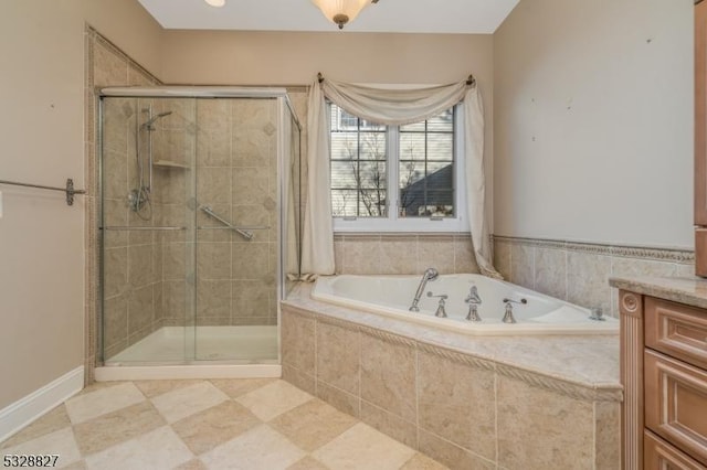 bathroom with vanity and independent shower and bath