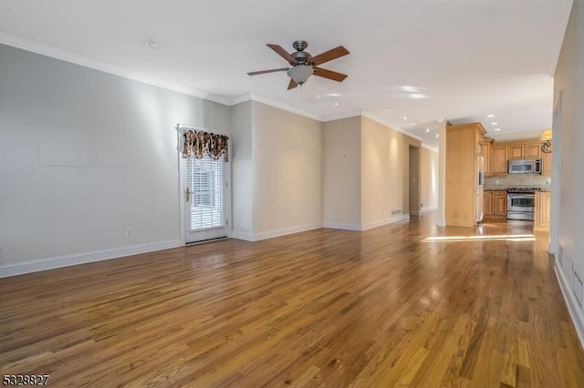 unfurnished living room featuring hardwood / wood-style floors, ceiling fan, and ornamental molding