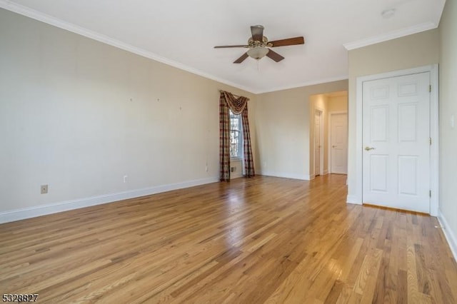 spare room featuring light hardwood / wood-style flooring, ceiling fan, and crown molding