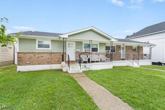 view of front of home featuring a front lawn and a porch