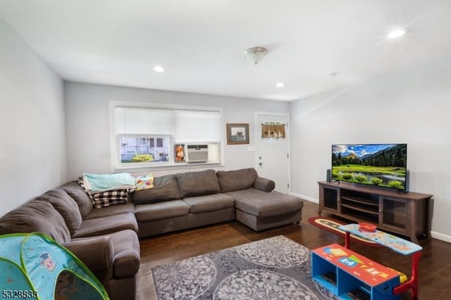 living room featuring cooling unit and dark wood-type flooring