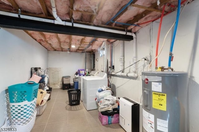 basement with separate washer and dryer, electric water heater, and light tile patterned floors