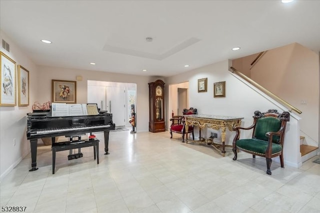 sitting room with a tray ceiling