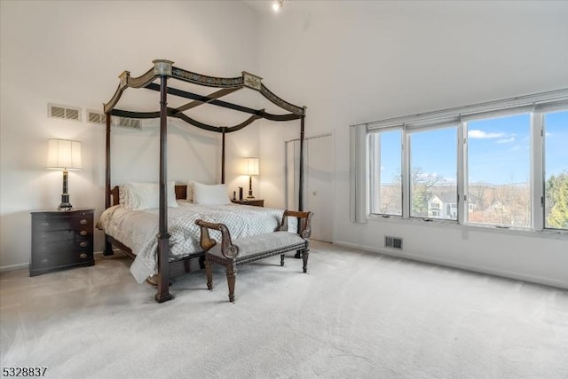 bedroom with light colored carpet