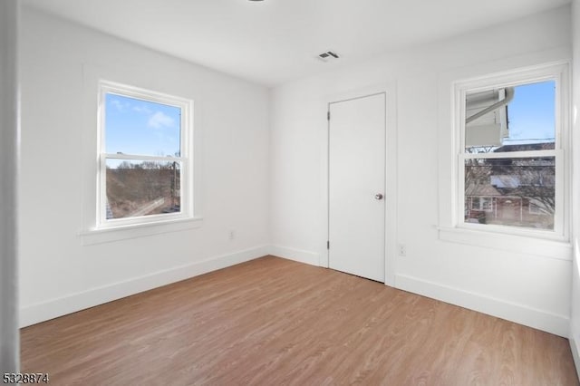 empty room featuring hardwood / wood-style floors