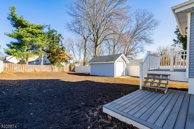 view of yard with an outbuilding and a wooden deck
