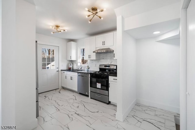 kitchen featuring white cabinetry, sink, stainless steel appliances, ventilation hood, and decorative backsplash