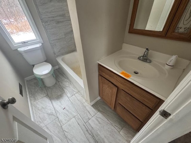 bathroom with walk in shower, vanity, and toilet