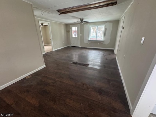 spare room featuring dark hardwood / wood-style floors and ceiling fan