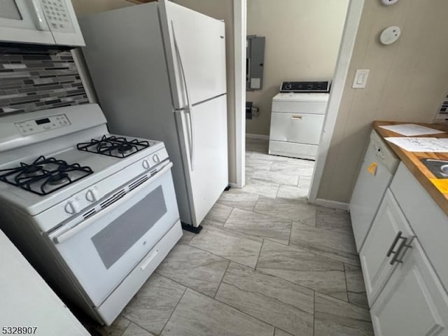 kitchen featuring white cabinetry, tasteful backsplash, electric panel, white appliances, and washer / dryer