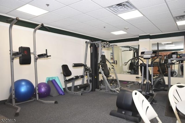 exercise room featuring a drop ceiling