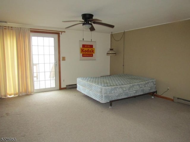 unfurnished bedroom with carpet, baseboard heating, and ceiling fan