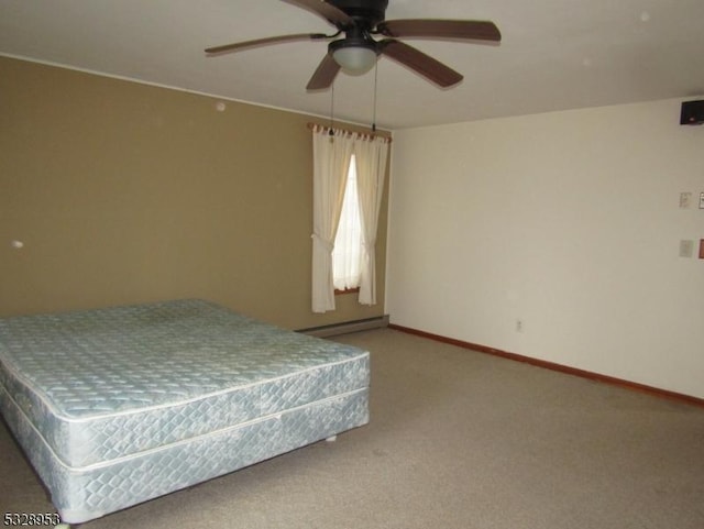 unfurnished bedroom with ceiling fan, carpet floors, and a baseboard radiator