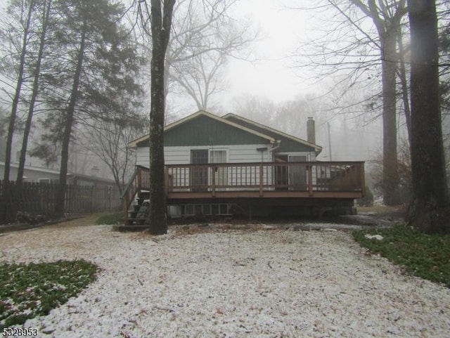 rear view of house with a deck