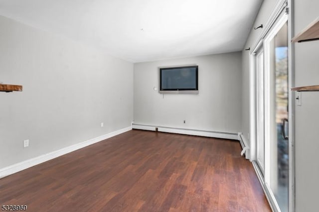 unfurnished room with dark hardwood / wood-style floors and a baseboard radiator