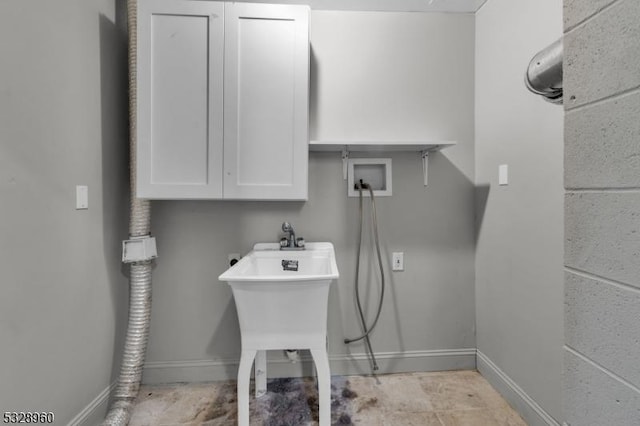 laundry room with electric dryer hookup, cabinets, and hookup for a washing machine