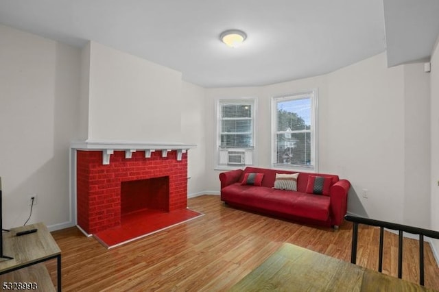 living room featuring a fireplace and hardwood / wood-style floors