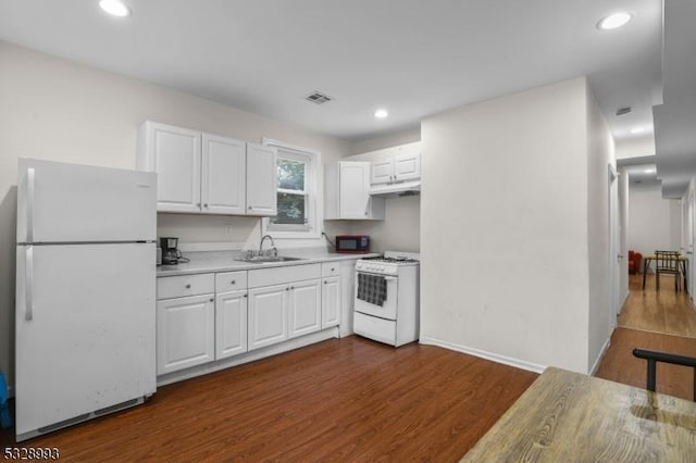 kitchen featuring white cabinets, dark hardwood / wood-style flooring, white appliances, and sink