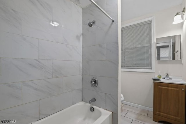 full bathroom with tile patterned floors, vanity, toilet, and tiled shower / bath