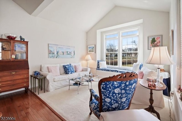 living room featuring hardwood / wood-style floors and lofted ceiling