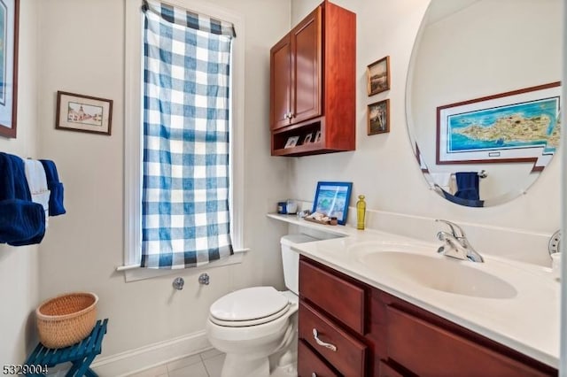 bathroom with tile patterned floors, vanity, and toilet