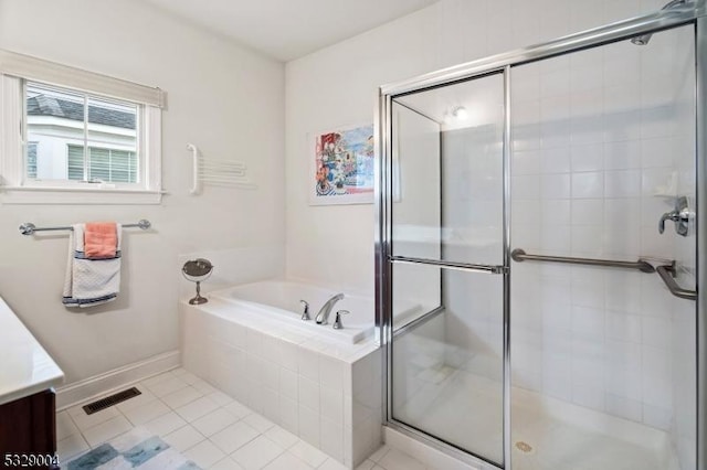 bathroom with tile patterned flooring, vanity, and independent shower and bath