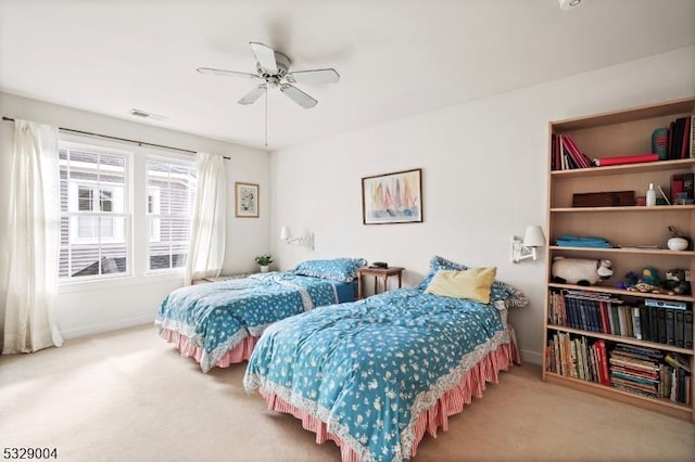 bedroom with ceiling fan and carpet floors