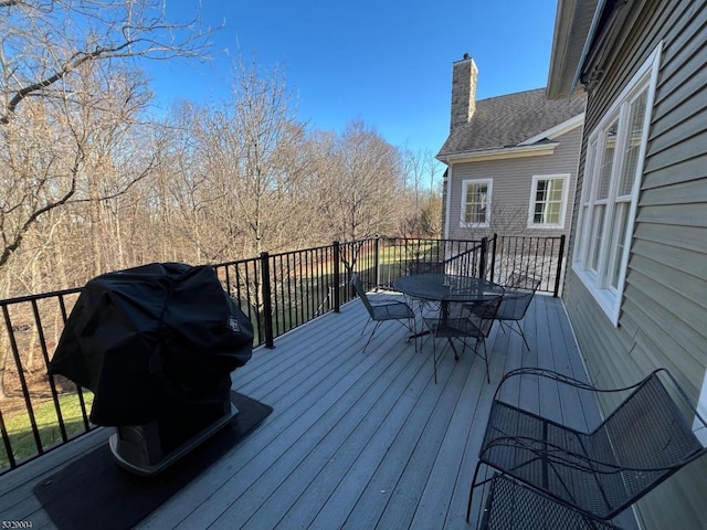 wooden deck featuring grilling area