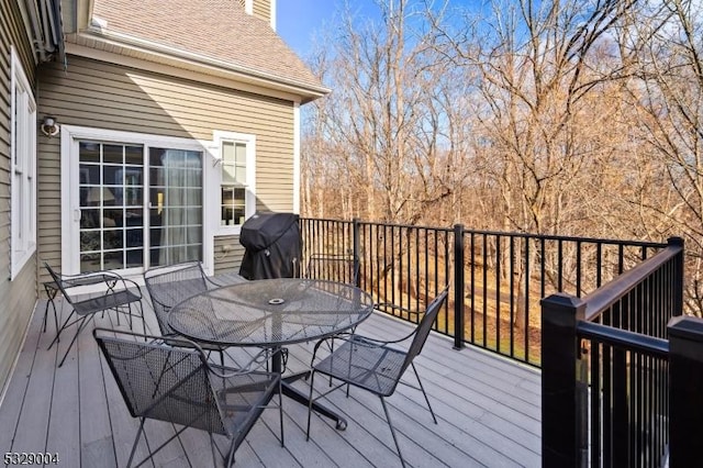 deck featuring a grill