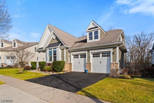 view of front of house with a front lawn and a garage