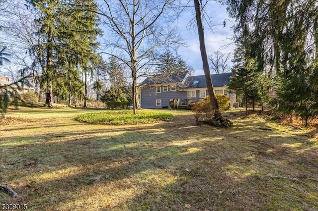 view of yard featuring a wooden deck