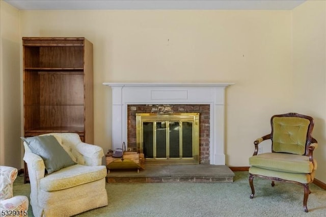 living area with carpet flooring and a fireplace