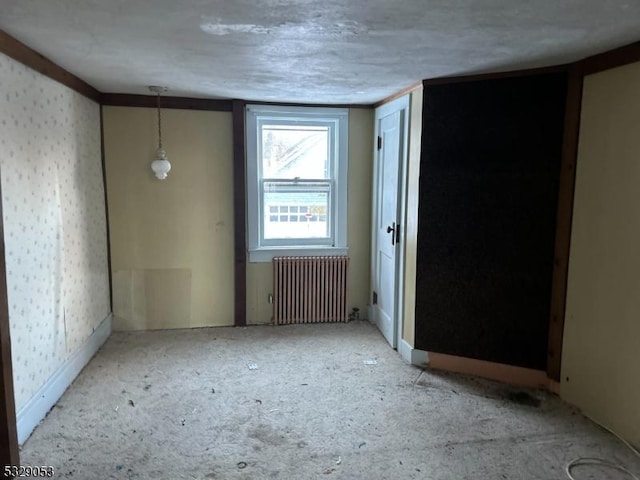 empty room featuring radiator heating unit