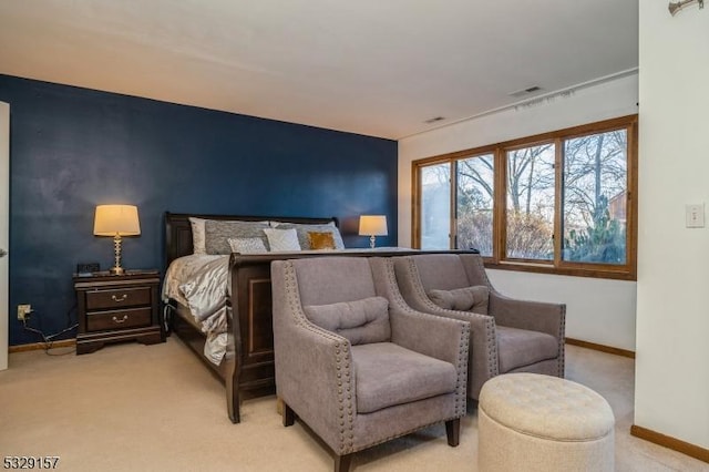 bedroom featuring light carpet