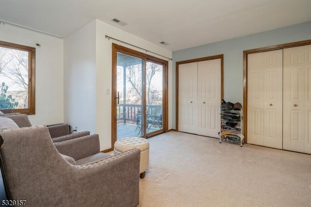 living area with light colored carpet