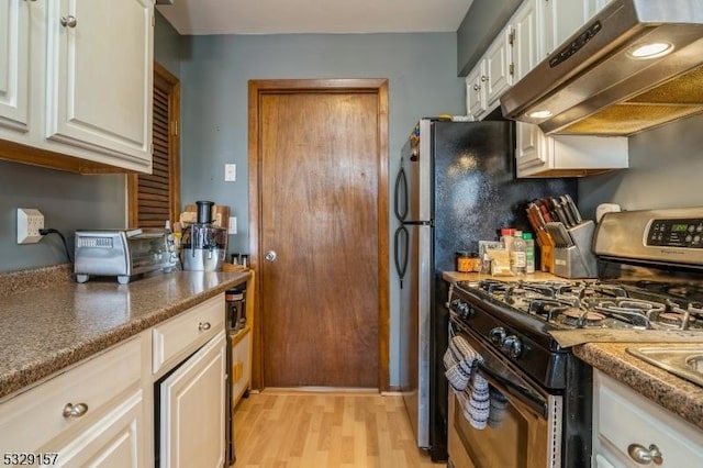 kitchen featuring light hardwood / wood-style flooring, ventilation hood, white cabinetry, and stainless steel range with gas stovetop