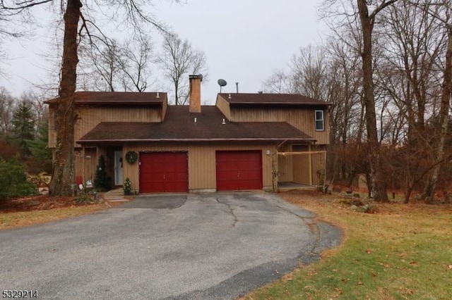 front of property with a garage