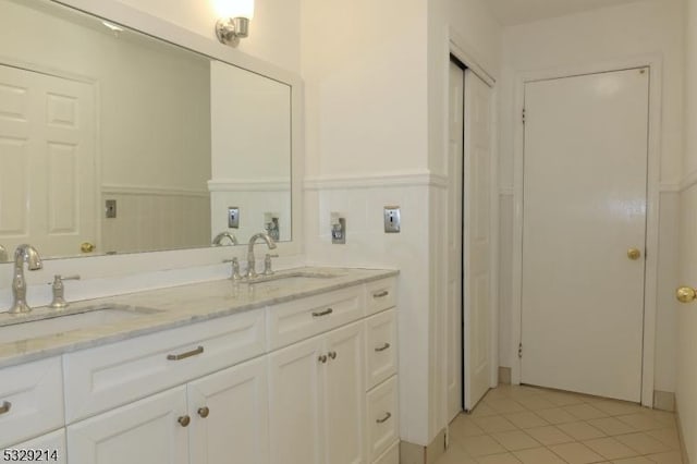 bathroom featuring tile patterned floors and vanity