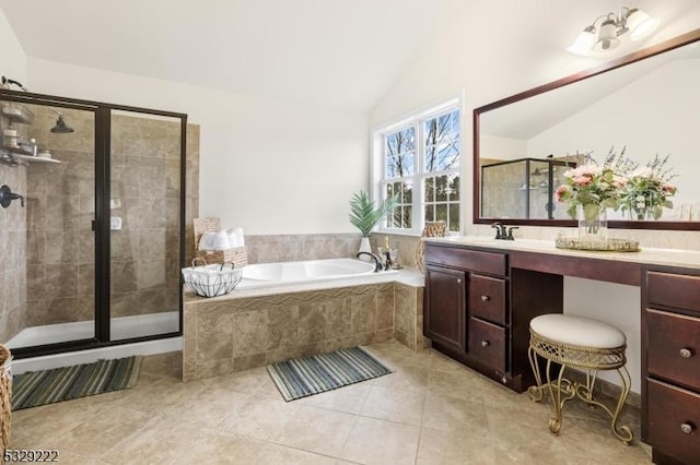 bathroom with tile patterned flooring, vanity, independent shower and bath, and vaulted ceiling