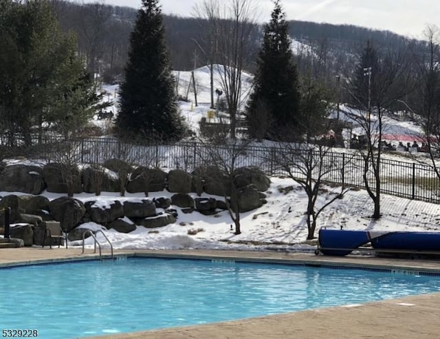 view of snow covered pool