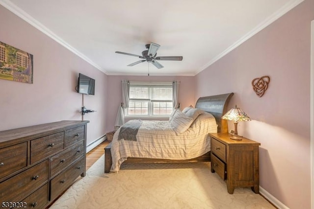 bedroom with ceiling fan, ornamental molding, baseboard heating, and light hardwood / wood-style flooring