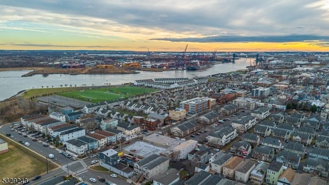 aerial view at dusk with a water view