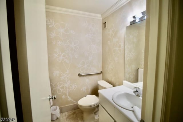 bathroom with toilet, ornamental molding, tile patterned flooring, and vanity